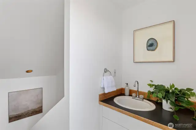 Just inside the rooftop deck is a wet bar with sink making entertaining a snap