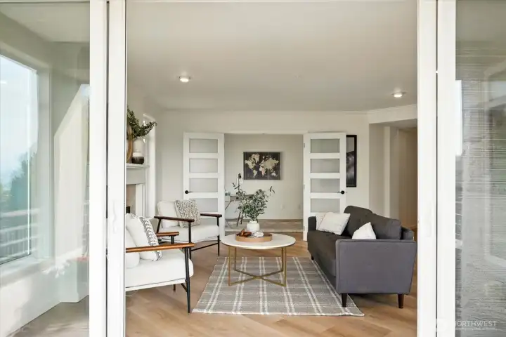 Covered deck flows into spacious main living area.