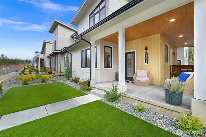 Easy living with low maintenance landscaping (rocks and artificial tuff).