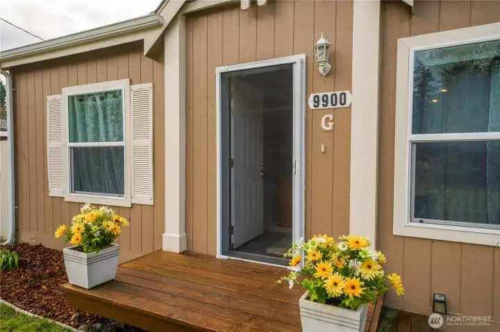 This easy-care outdoor space features a roll-up screen, making it comfortable to enjoy fresh PNW air while adding shade and flexibility throughout the day.