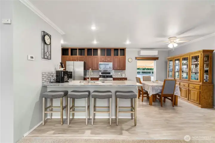 The kitchen and dining area sit right at the heart of the home, perfect for shared meals, conversation, and daily routines.