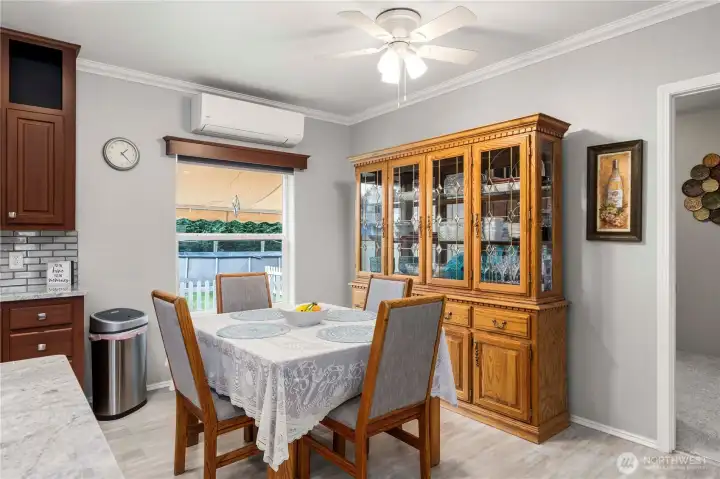 The dining area offers a comfortable spot for meals and gatherings, with natural light and room to host without feeling formal.