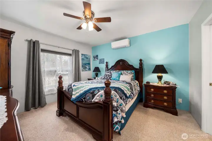 The primary bedroom feels calm and comfortable, with a mini-split system that helps keep the space just right year-round.