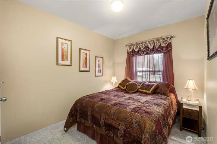 This 2nd bedroom works well as a guest room or flex space, offering comfort and versatility.