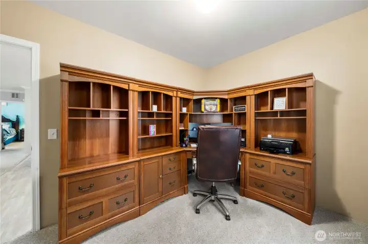 This third bedroom offers a flexible space for guests, work, or hobbies, with blackout honeycomb shades for comfort and privacy.