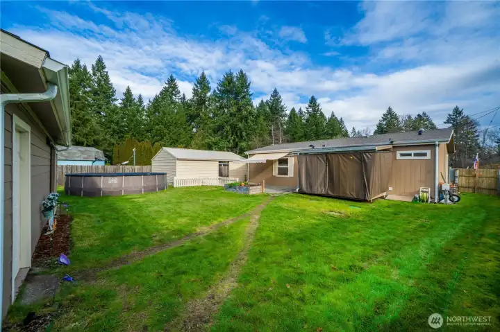 This long view of the yard shows plenty of open space, making it perfect for play and outdoor fun.