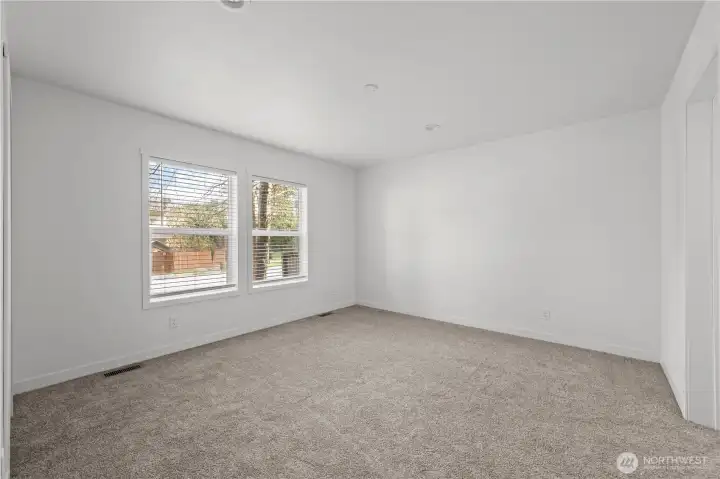 Primary bedroom with private bath & two walk-in closets
