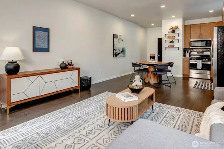 Open concept design unifies the living, dining, and kitchen areas