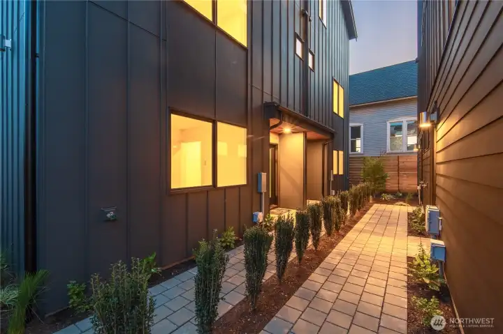 Stunning landscaped courtyard seperates the front homes from the back home and