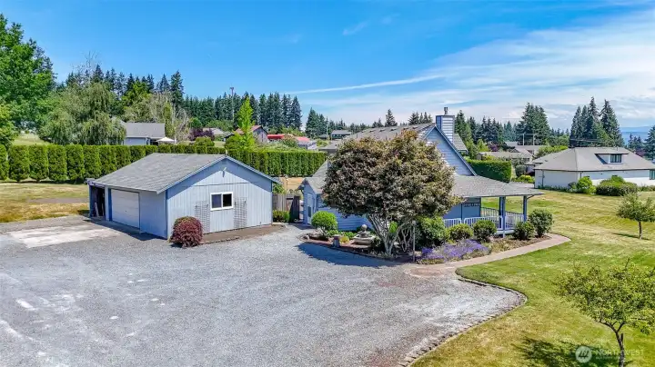 Side view of home and garage w/tons of parking.