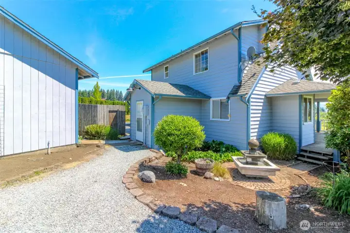 Walk way to back door- love the water feature!