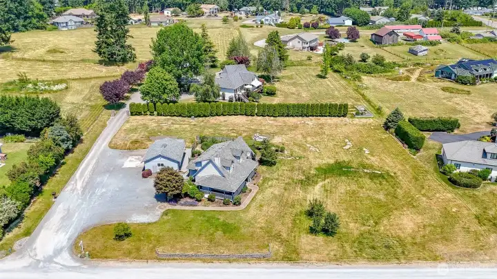 Aerial view of custom home on 1.3 acres.
