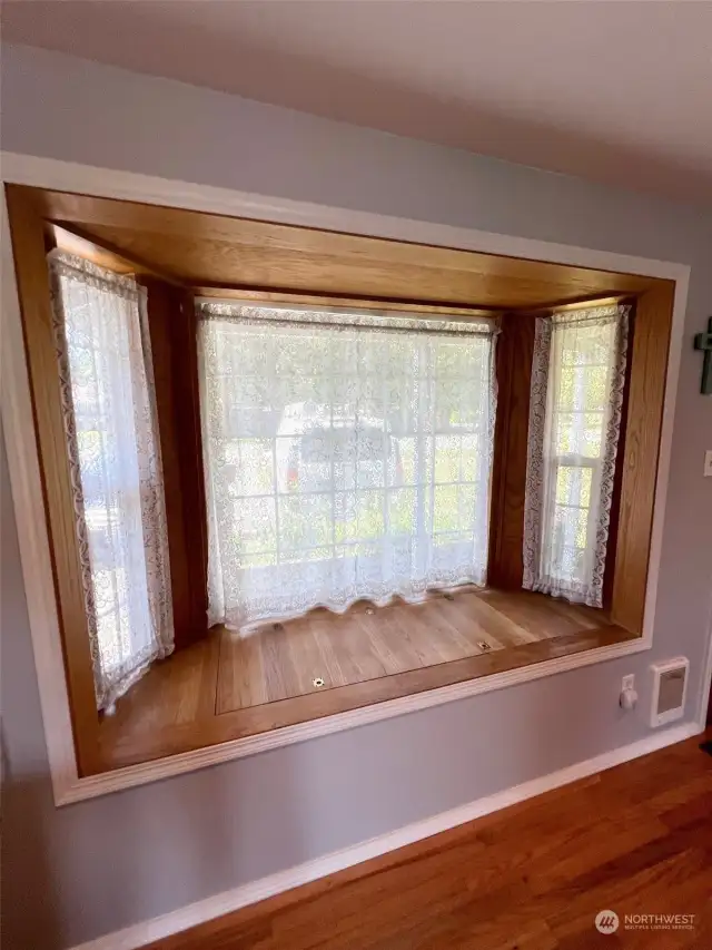 Huge bay window in living room has storage