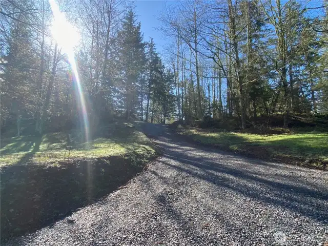 Newly installed 100' driveway. Utilities trenched in on either side of the driveway. Power and water meters installed.