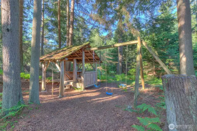 Play area in the woods adjacent to the lake.