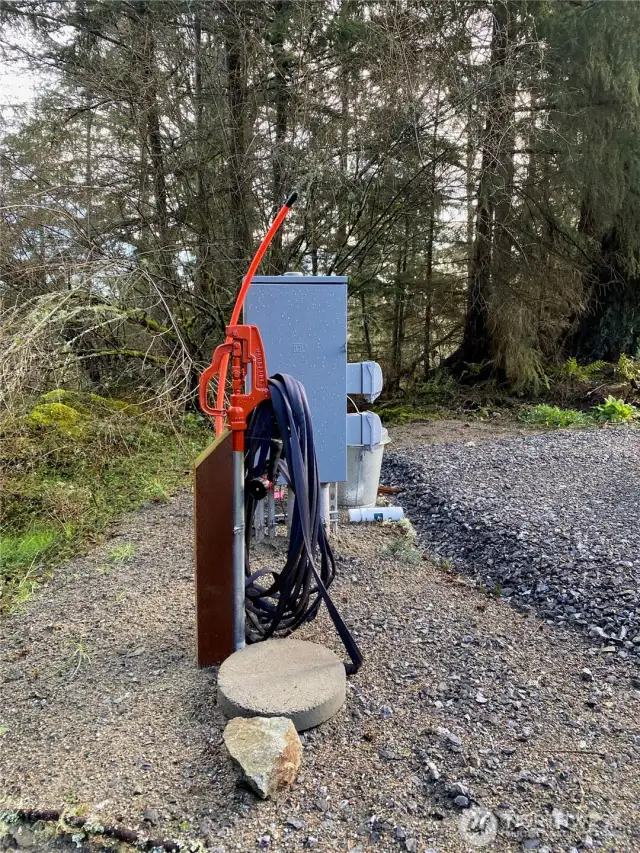 Power and water installed and ready! Shut-off valve under round paver. Fiber ready to be pulled.