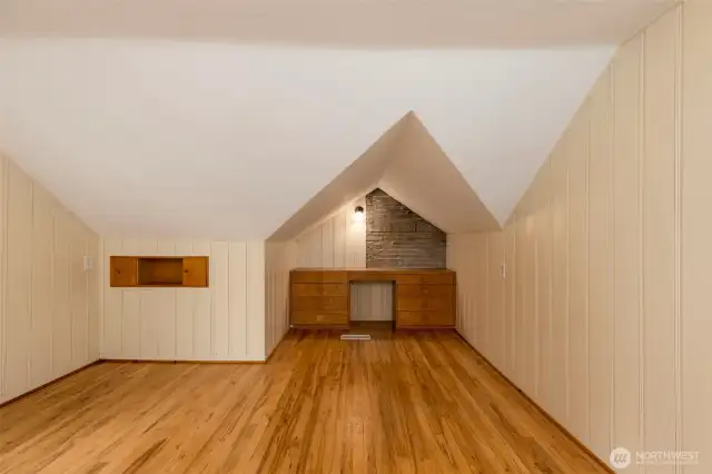 A roomy guest room featuring a built-in desk