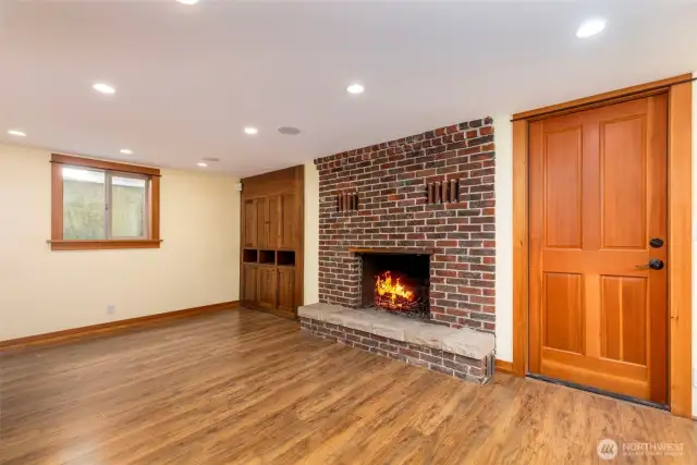 A warm fireplace and a built-in entertainment center comes equipped with wiring for surround sound