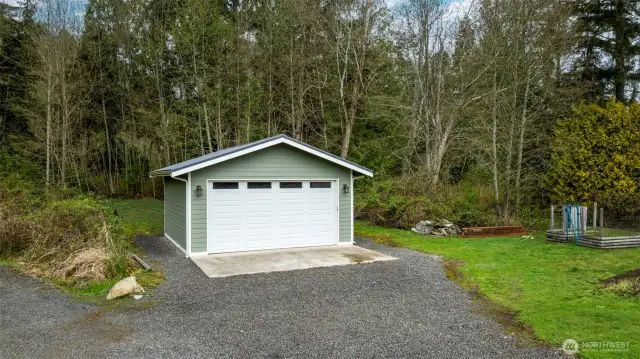 A garage or workshop that accommodates two cars