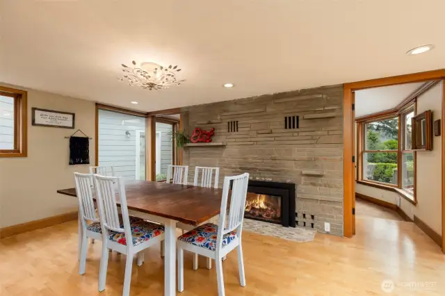 Dining area featuring a warm and inviting fireplace