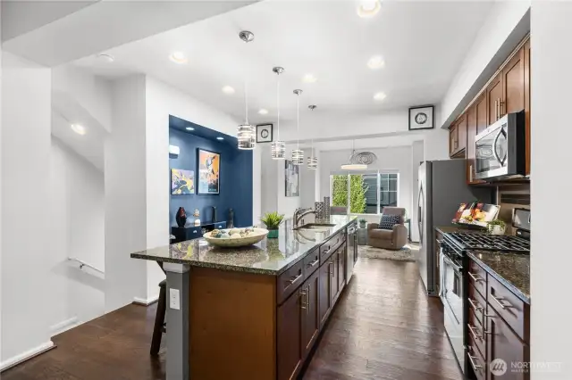 Enjoy the natural light from outside while sipping coffee at the large kitchen island.