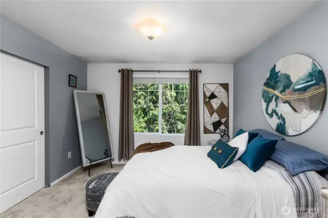 Primary suite overlooking the green space.