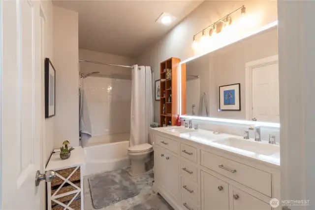 Primary Suite Retreat – Spacious en suite bath featuring a relaxing soaking tub, dual-sink vanity, and walk-in closet. The perfect blend of comfort and functionality for your private getaway.