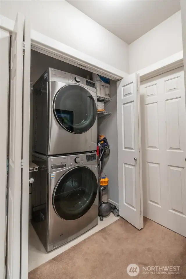 Spacious laundry area with convenient stackable washer and dryer included—designed for efficiency and extra storage. Perfect for modern living, this large utility space makes household chores easier while adding value and functionality to the home.