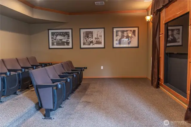 Residents enjoy shared access to a private theatre room, perfect for movie nights or entertaining guests.