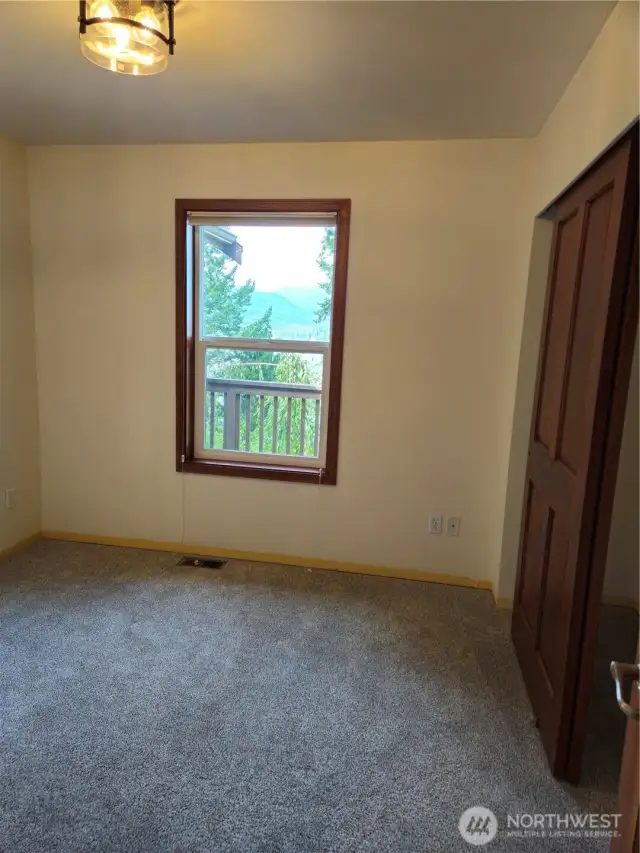 Bedroom 2 takes in views of Hood Canal and the Olympic Mountain Range, Full size closet and new carpet