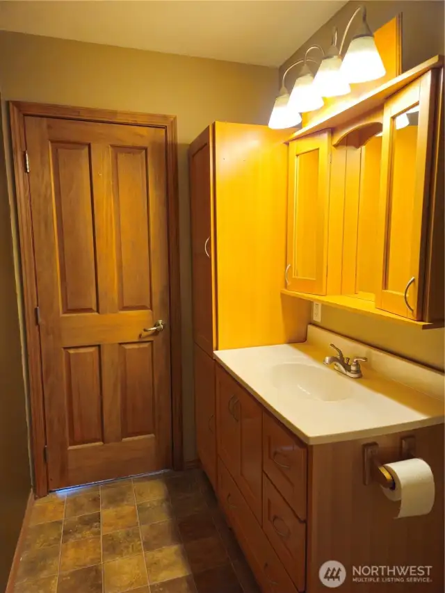 There is a large vanity in the main bath together with a linen closet!