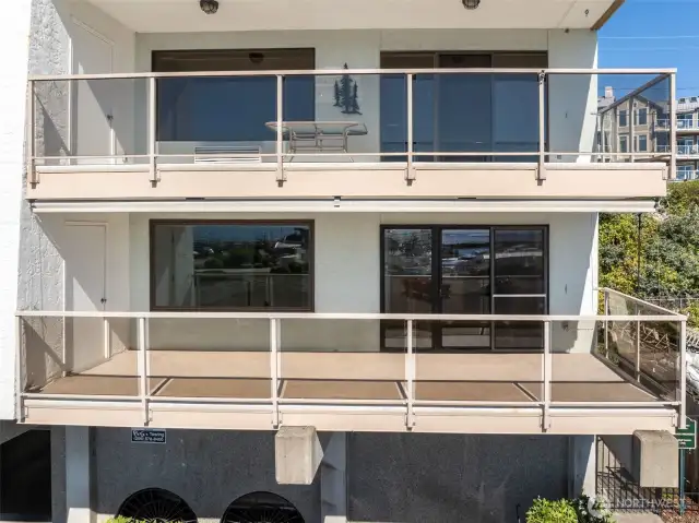 Expansive deck featuring an attached storage unit, perfect for gatherings or quiet relaxation.