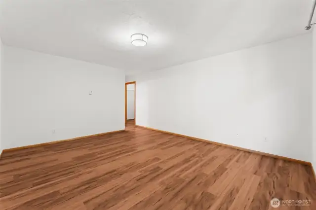 Spacious primary bedroom with private bath and walk-in closet.