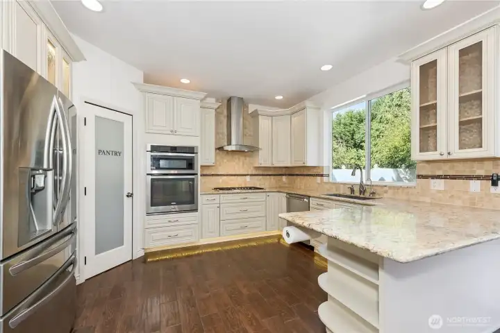 Recently remodeled kitchen with J&K cabinets, quartz counters, and luxury appliances.