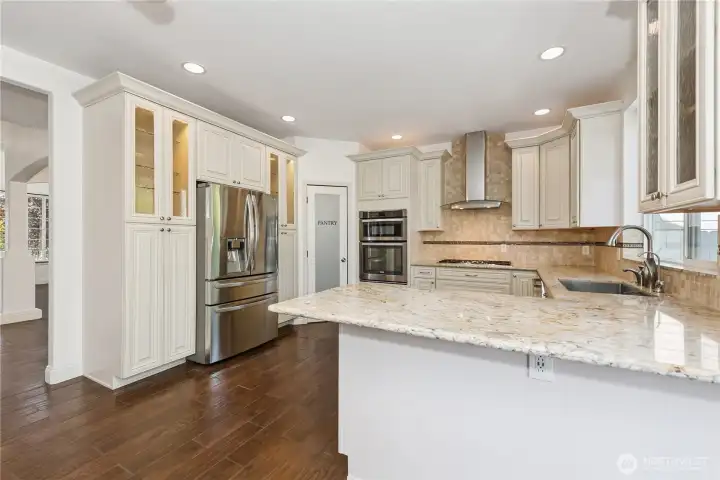 Abundant accent lighting makes this kitchen ideal for entertaining.