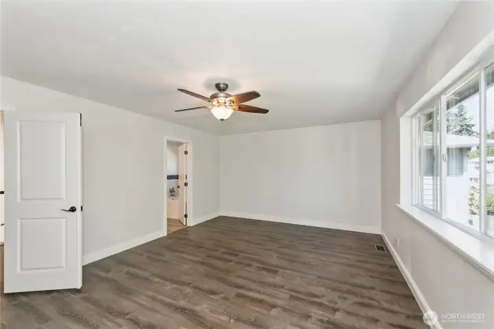 Expansive primary bedroom with walk-in closet and spa-like ensuite bath.
