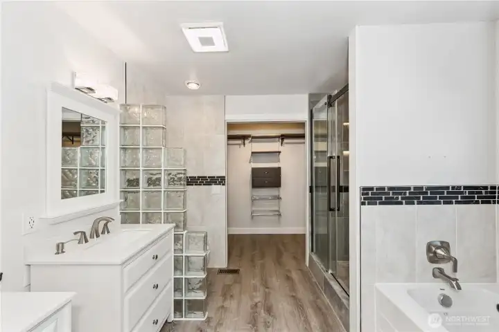 Relax and recharge in your beautifully updated bath with modern finishes.