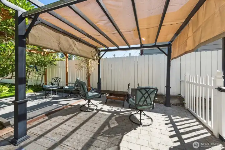 Multiple outdoor seating areas perfect for summer gatherings.