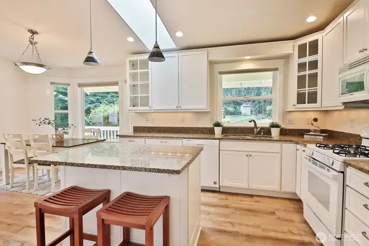 Generously sized kitchen. All appliances have been replaced during ownership. Sweet backyard view from the kitchen sink!