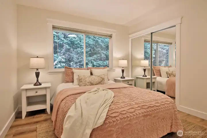 Bedroom #2. This is the bedroom straight ahead from the hallway that connects to the kitchen. Window looks out to the fenced east side of the home.