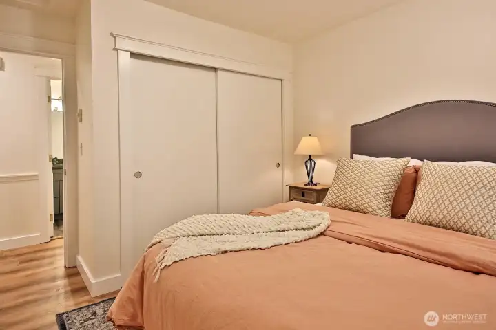 Standard sized closet. You can see the entrance to the bathroom across the hall. Entrance to the garage is to the right once in the hallway.