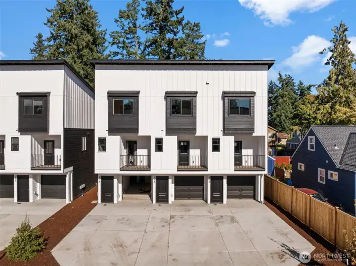 One of 2 triplex.Extra long driveways for additional parking spaces plus a deep one car garage.