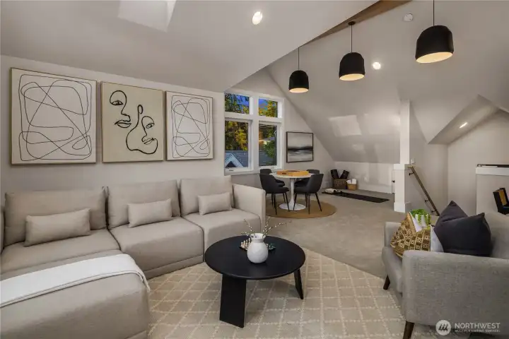 Large bonus great room with vaulted ceilings and stained wood beams