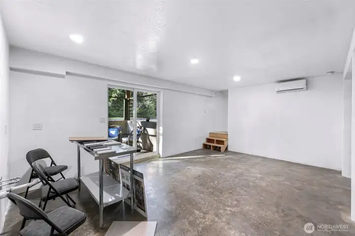 Other side of the stairs - kitchen hookups to the left.  A little design center for ideas - flooring, counters, backsplash, tiling is set up here for inspiration. Lower level is ready with kitchen hookups, space for an island, doors, finish of stairs, washer and dryer hookups, and the 3/4 bath.  Two bedrooms in place could be made into three if needed.  Minisplits, electrical, new sheetrock all set.