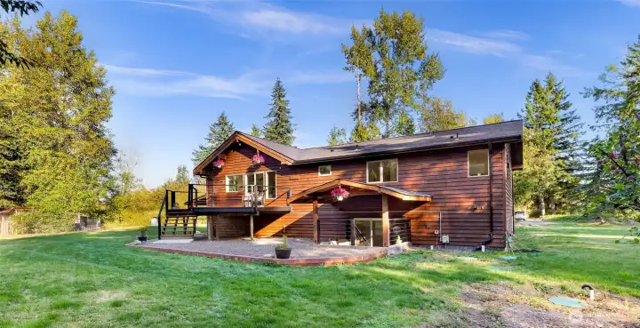 A chicken coop is seen to the right. Septic and external sump pump lids to the right.
