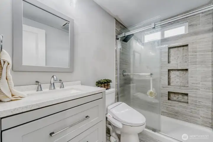 Updated bathroom with modern finishes.