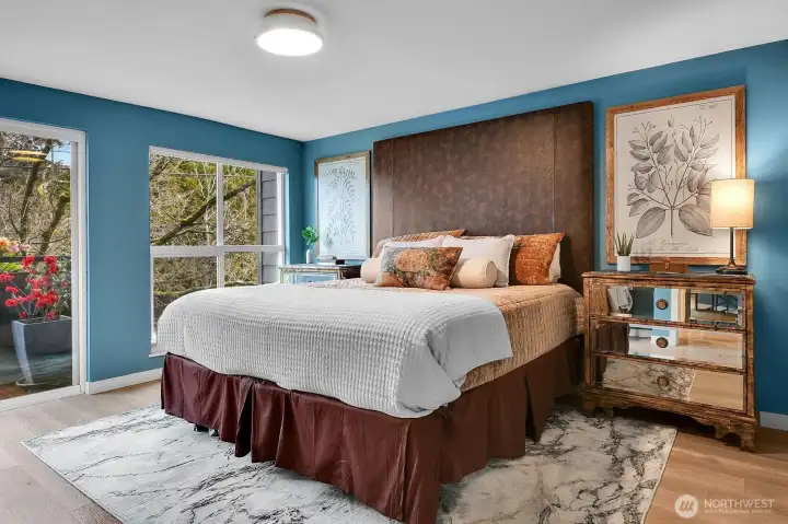 Spacious primary bedroom with its own private balcony.