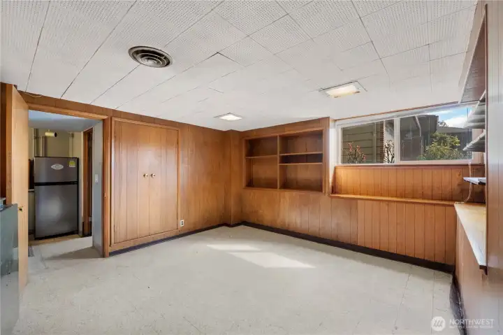 Basement bedroom with curtain for the door.