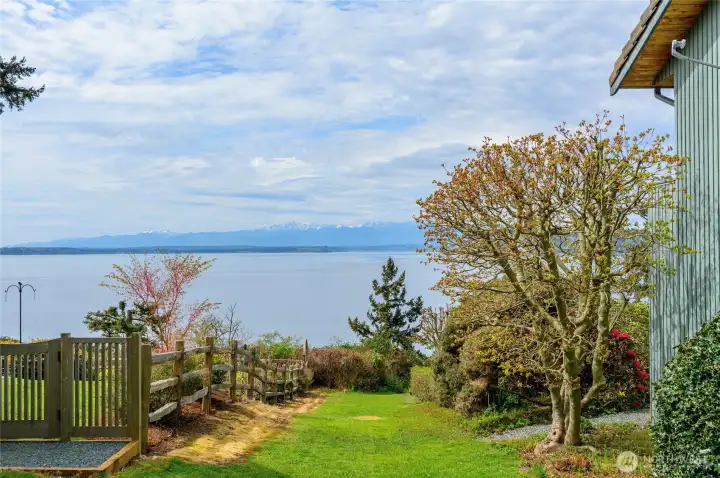 Follow the path towards the beach.