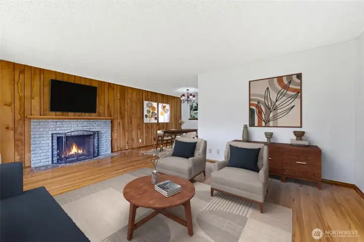 Cozy wood fireplace and real oak floors show authenticity.